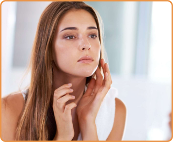 Woman touching her face