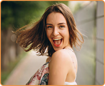 Woman with a big smile outdoors