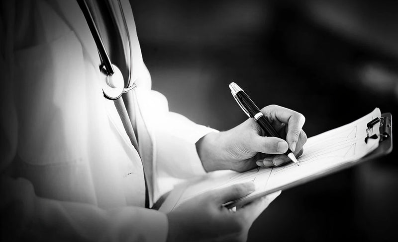 Person in a medical coat holding a pen and clipboard, likely a doctor or nurse